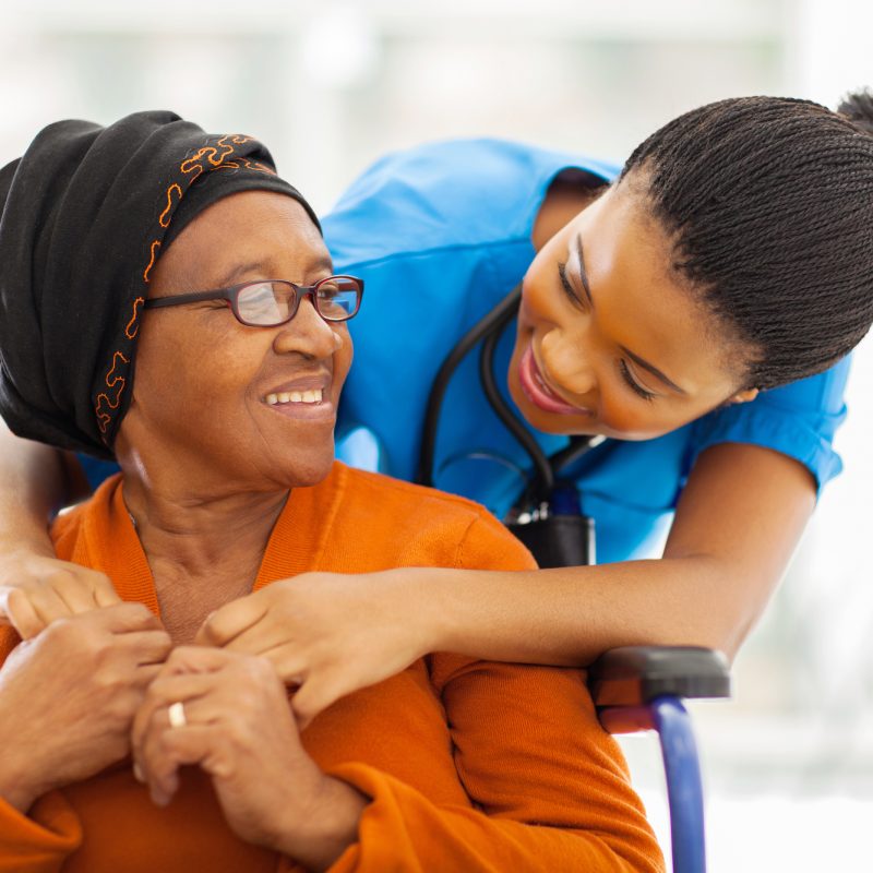 happy senior patient with friendly female nurse